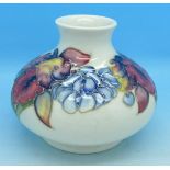 A Moorcroft squat vase with label 'Potter to the late Queen Mary', crazed, 8.