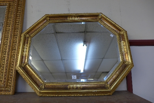 An octagonal gilt framed mirror