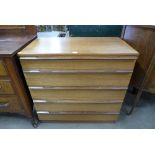 A teak chest of drawers