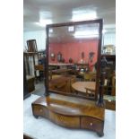 A George III inlaid mahogany serpentine toilet mirror