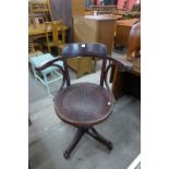 A bentwood swivel chair