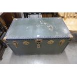 A green steamer trunk