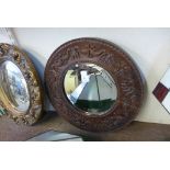 A carved oak mirror