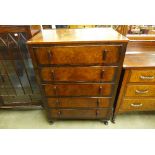 A walnut chest of drawers