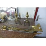 A pair of brass andirons and companion set