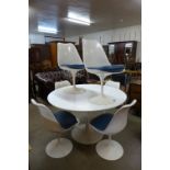 An Arkana white circular tulip dining table and six chairs