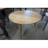 A light oak circular coffee table