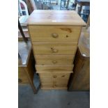 A pair of pine bedside cupboards