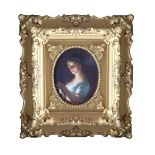 An early 19th Century portrait miniature of a lady, oval quarter length, on porcelain, 8.