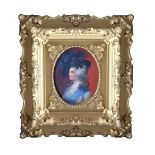 An early 19th Century portrait miniature of a lady, oval quarter length, on porcelain, 8.