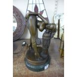 A bronze figure of a nude female