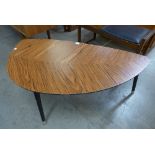 A rosewood effect leaf shaped coffee table