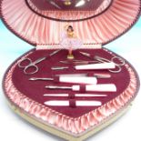 A cased musical manicure set