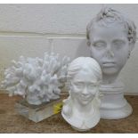 A reconstituted stone bust of Eros and a bust of a young girl, after Bessi, and a piece of coral,