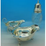Two silver sauce boats and a silver topped glass shaker, weight of silver 184g,