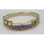 A 9ct gold, blue and white stone bangle, Chester hallmark, 9.