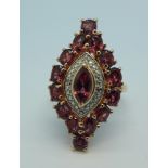 A silver gilt, rhodolite garnet ring,