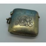 A silver vesta case, with initials,