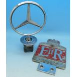 A Mercedes Benz car mascot and a 1953 Coronation badge