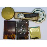 Three compacts including two Stratton, a wristwatch and a tortoiseshell and abalone case/wallet,