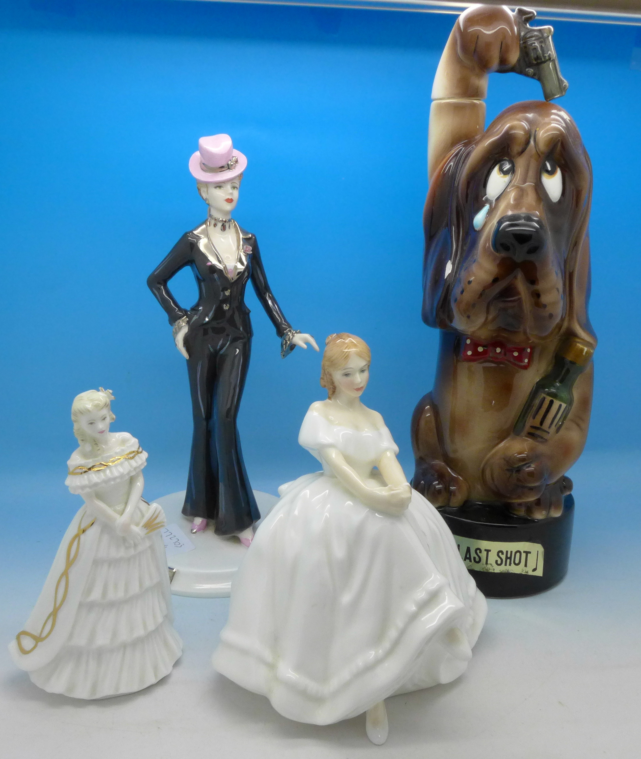 A novelty dog musical decanter, The Last Shot, two Coalport figures,