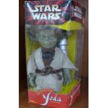 A Star Wars Yoda figure,