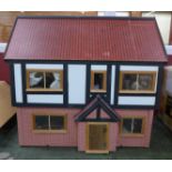 A dolls house, with furniture and accessories,