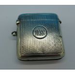 A silver vesta case, with initials,