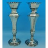 A pair of silver vases,