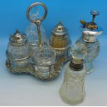A plated cruet and two silver mounted scent bottles