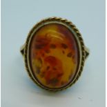 A 9ct gold and amber ring, 3.