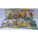A collection of Rupert annuals and Adventure Books