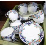 A Delphine china tea service; six cups, ten saucers, ten medium plates,