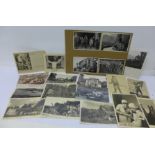 A collection of thirty-one German pre and WWII postcards, and eight photograph postcards of Hitler,