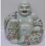 A ceramic Buddha figure with mark on base,