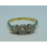 An 18ct gold, platinum and old cut three stone diamond ring,