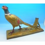 A large cold painted pheasant match striker, length of base 30.
