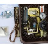 Assorted items including a brass eye glass, thimbles, beer advertising bottle opener,