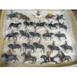 A quantity of Britains lead horse figures with cowboys,