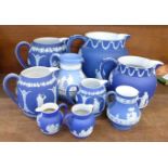 A set of three graduated and two sets of two Wedgwood Jasperware jugs and two others (9), some a/f,