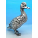 A cast metal and plated model of a duck,