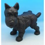 A cast iron dog doorstop