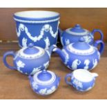 Six items of Wedgwood Jasperware; three teapots, a jardiniere, cream and sugar bowl,