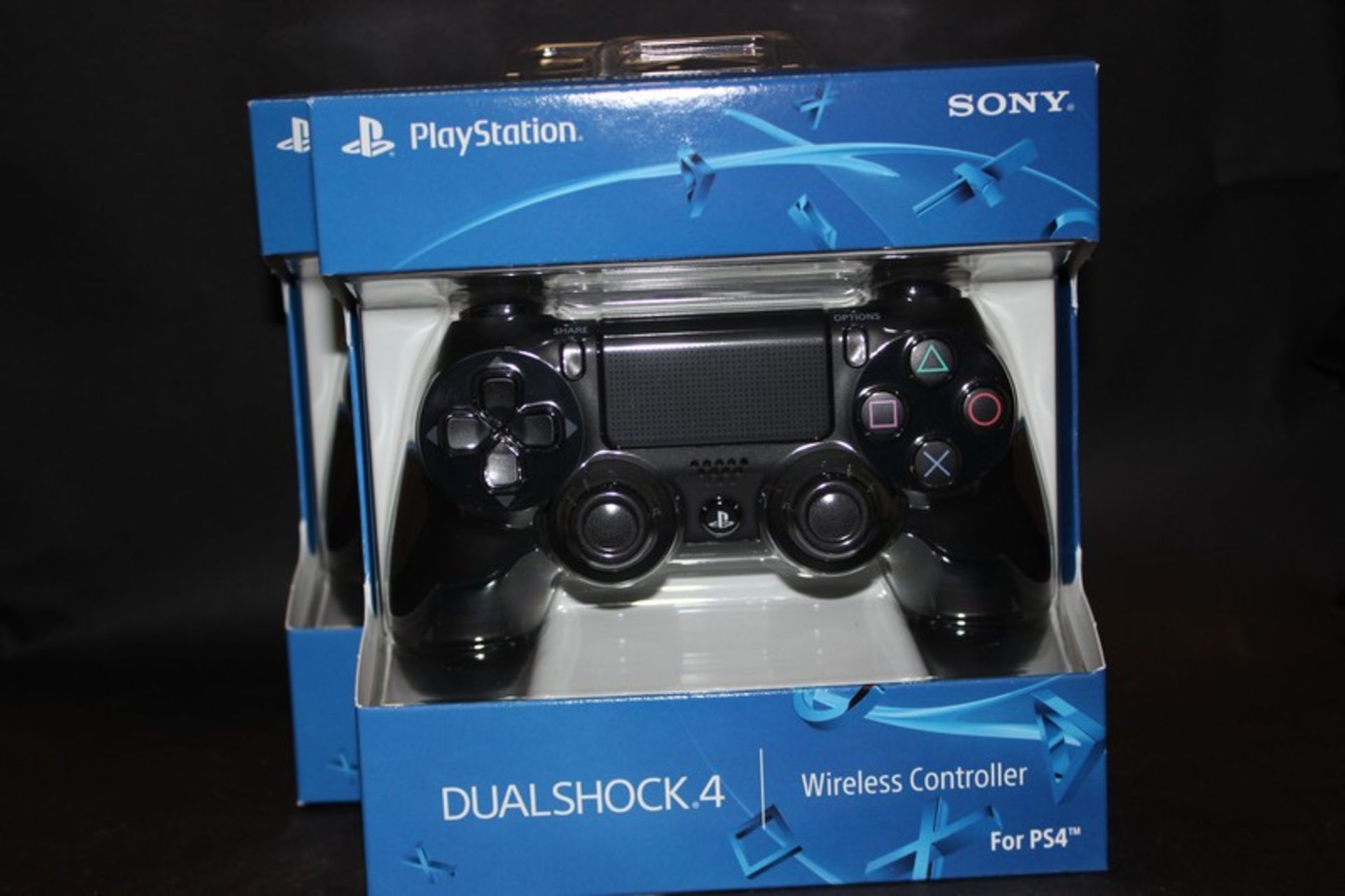 Two PlayStation 4 wireless DualShock controllers (Boxed as new).