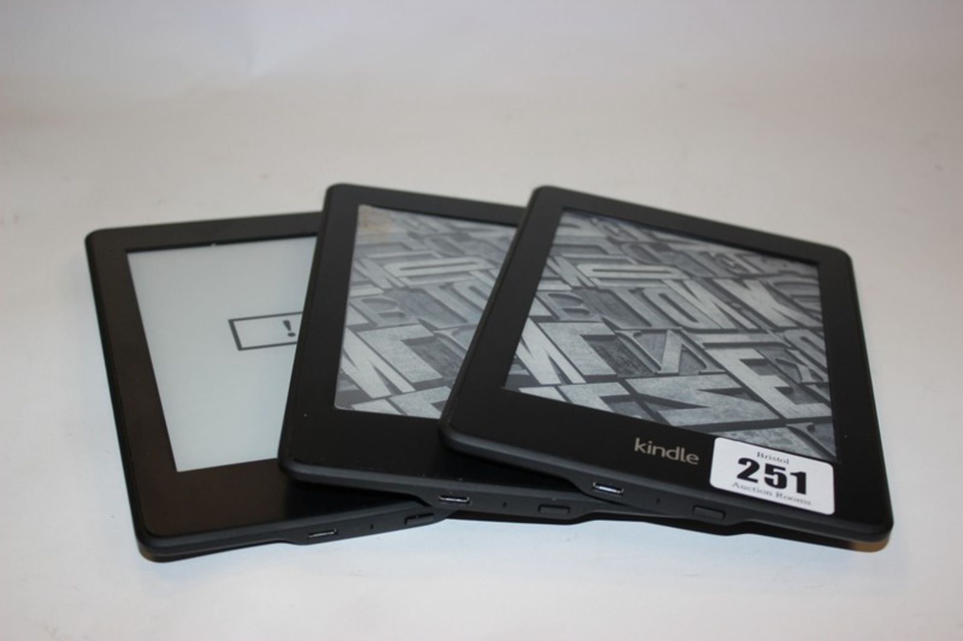 Two Kindle Paperwhite 2 (2013) model: DP75SDI and a Kindle Paperwhite 3 (2015) model: DP75SDI.