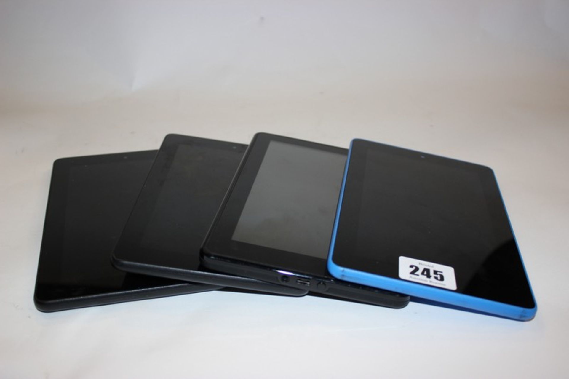 Three Amazon Kindle Fire 5th Generation model: SV98LN and an Amazon Kindle Fire model: D01400.