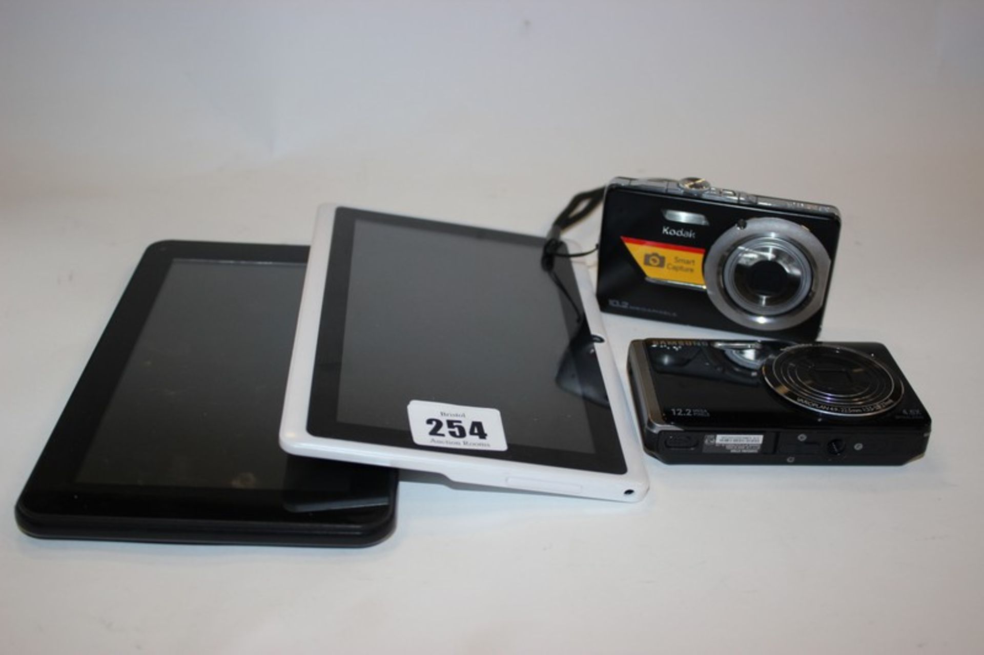A Cyclone Explorer tablet, Quad Core 8GB model: A7N15Q tablet, a Samsung ST500 camera and a Kodak