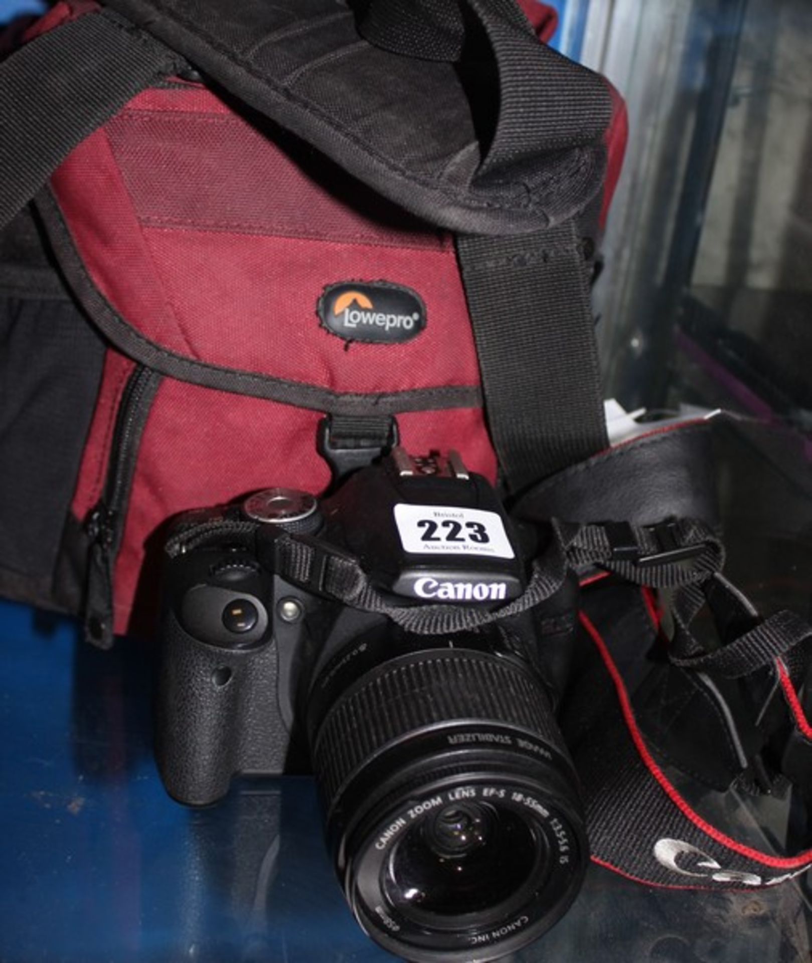 A Canon EOS Rebel T1i camera with a Canon EFS 55-250MM lens and a Canon EFS 18-55mm lens in carry