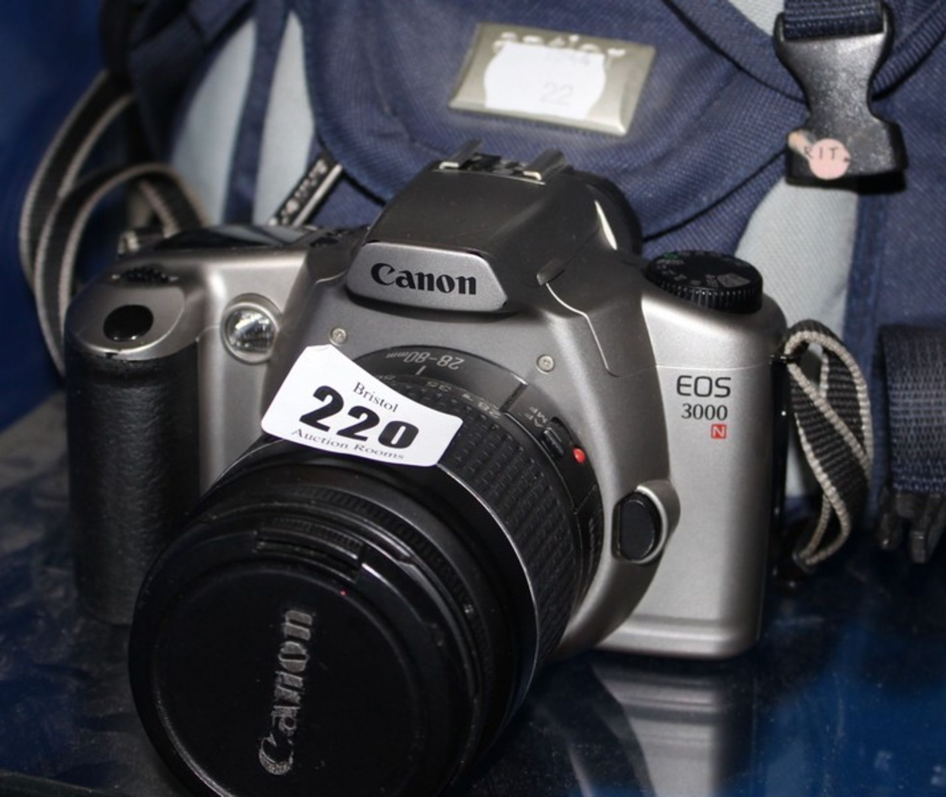A Canon EOS3000 35mm camera with 28-80mm lens, 80-200mm lens and case.