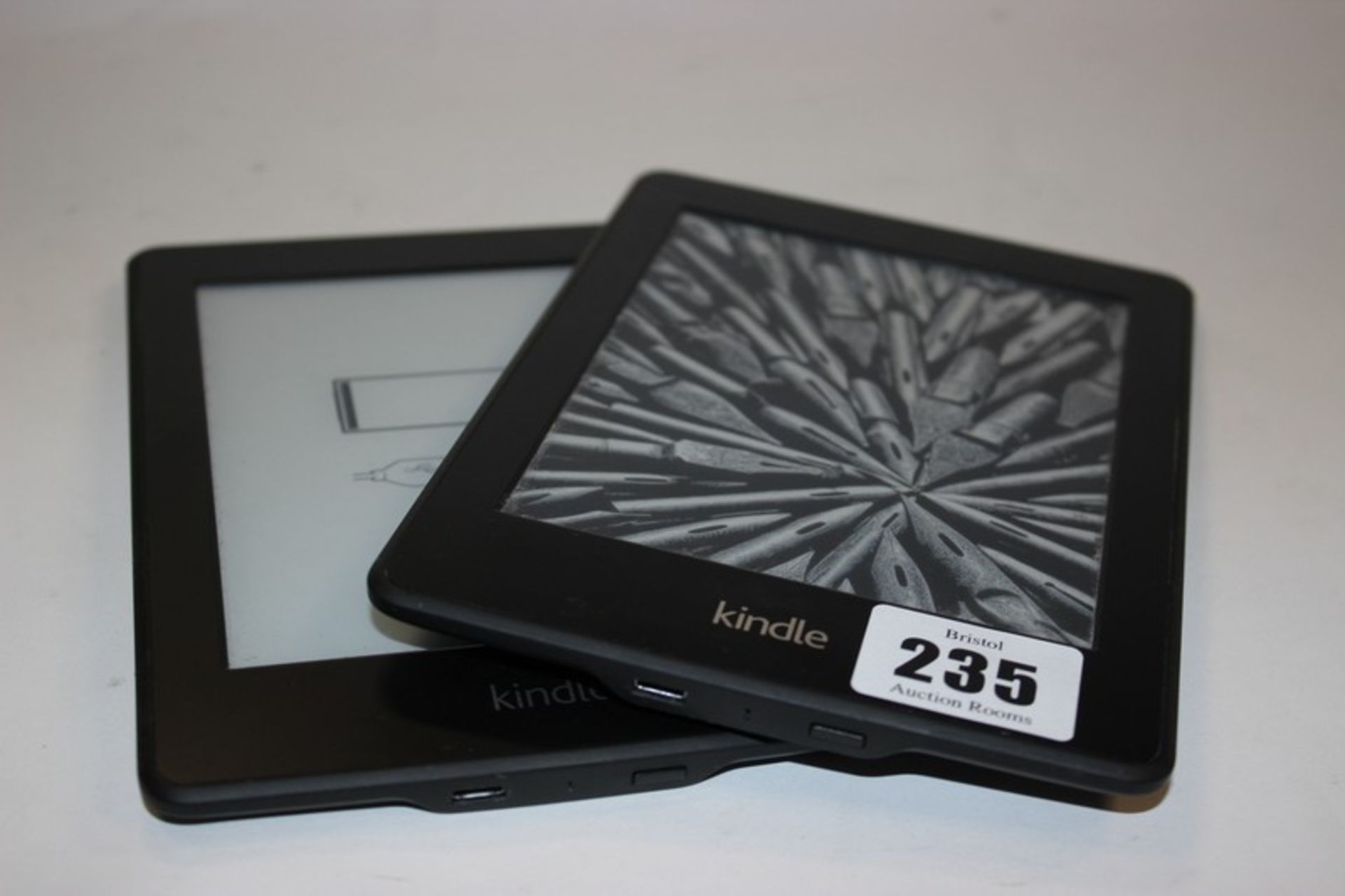 A Kindle Paperwhite (2013) model: DP75SDI and a Kindle Paperwhite model: EY21.